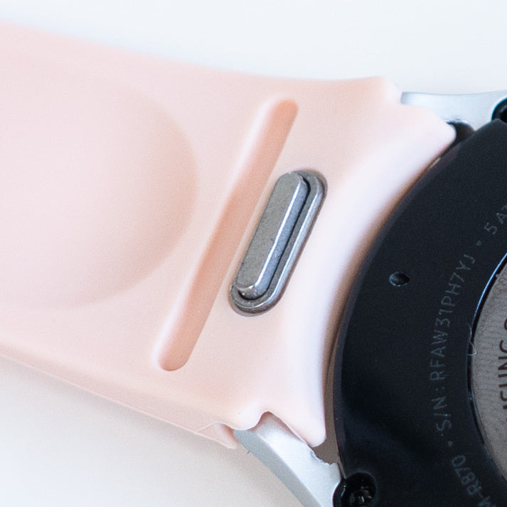 Silicone Strap 'One Push', pink, on a watch, 3/4 rear view