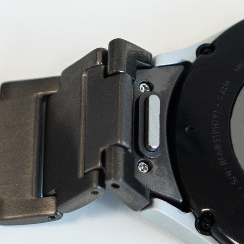 Titanium Strap 'One Push', graphite, on a watch, 3/4 rear view