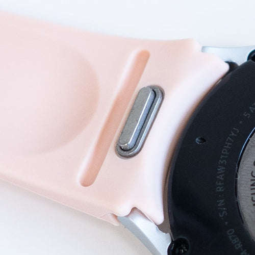 Silicone Strap 'One Push', pink, on a watch, 3/4 rear view