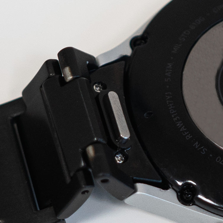 Titanium Strap 'One Push', black, on a watch, 3/4 rear view